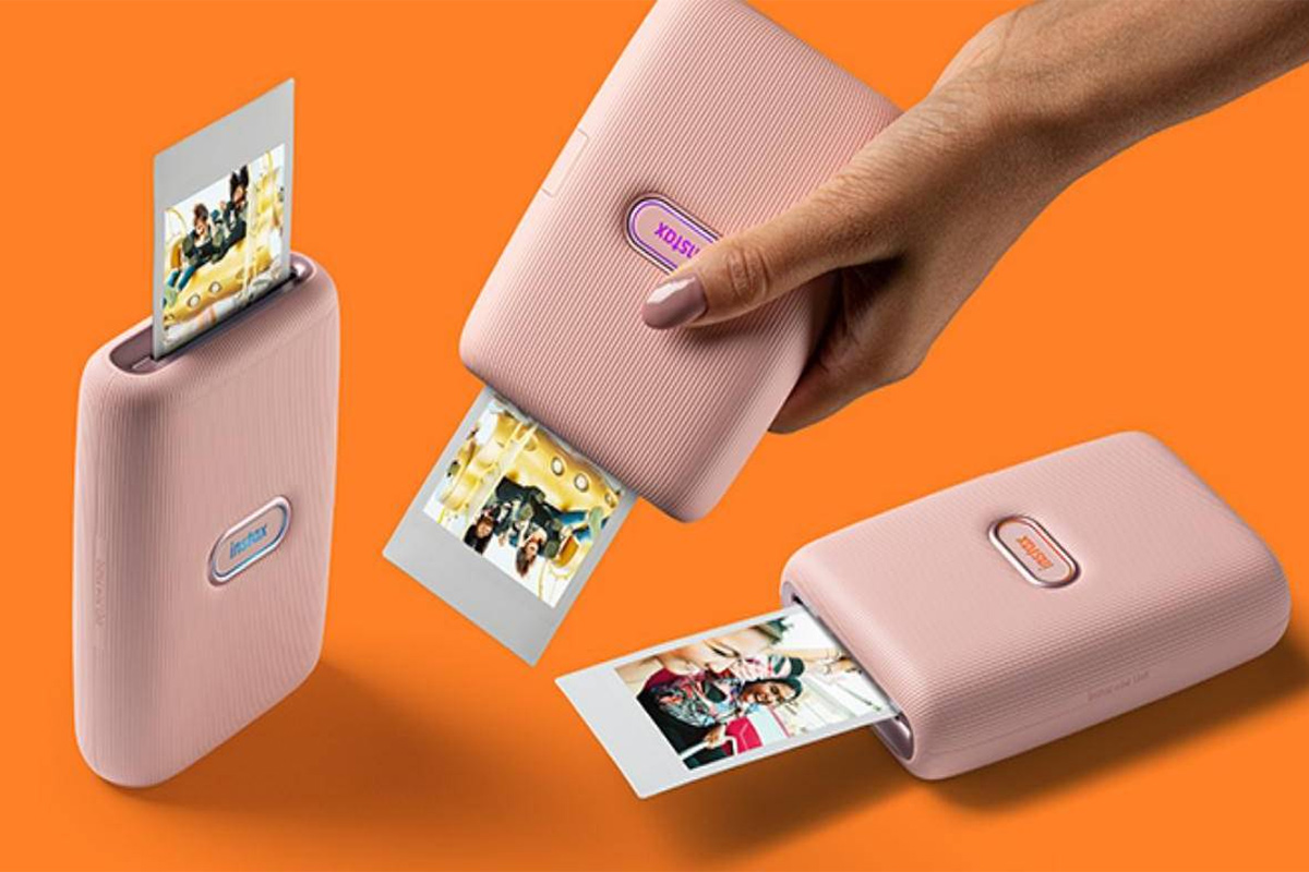 Máy in ảnh cầm tay là một thiết bị nhỏ gọn là một thiết bị dùng để in ảnh từ các nguồn khác nhau Máy in ảnh cầm tay là một thiết bị nhỏ gọn là một thiết bị dùng để in ảnh từ các nguồn khác nhau